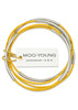 leather skinny bangles shown in a bright citrus yellow with silver colored stainless steel beads.
